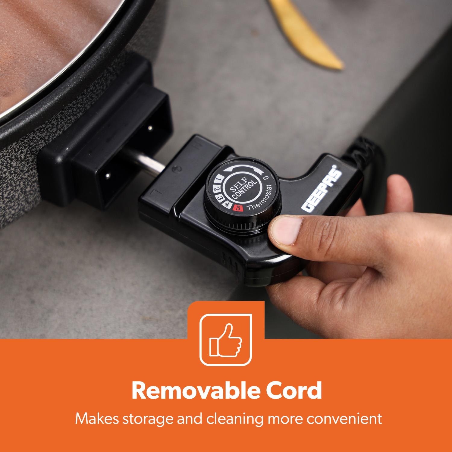 The image shows off the removable cord of the multicooker, this makes storeage and cleaning a lot easier.