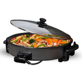 The image shows off the electric wok and multi cooker on a white background with food cooking inside.