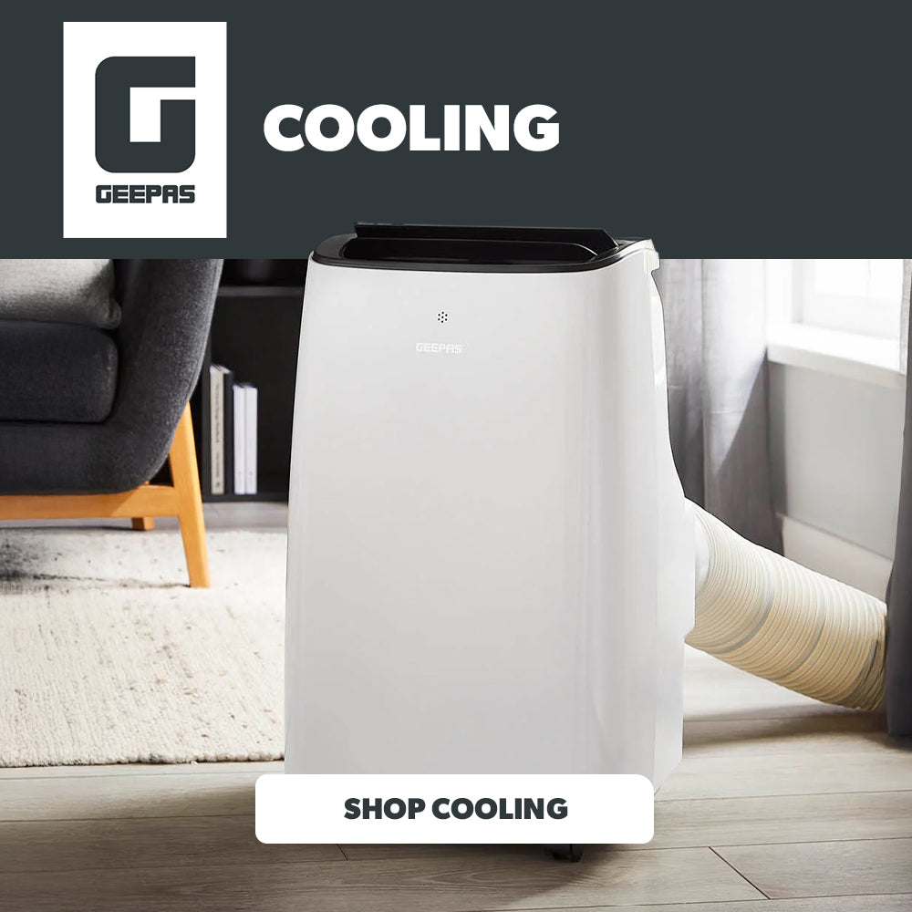 White air conditioning unit in a living room with 'Cooling' text and logo.