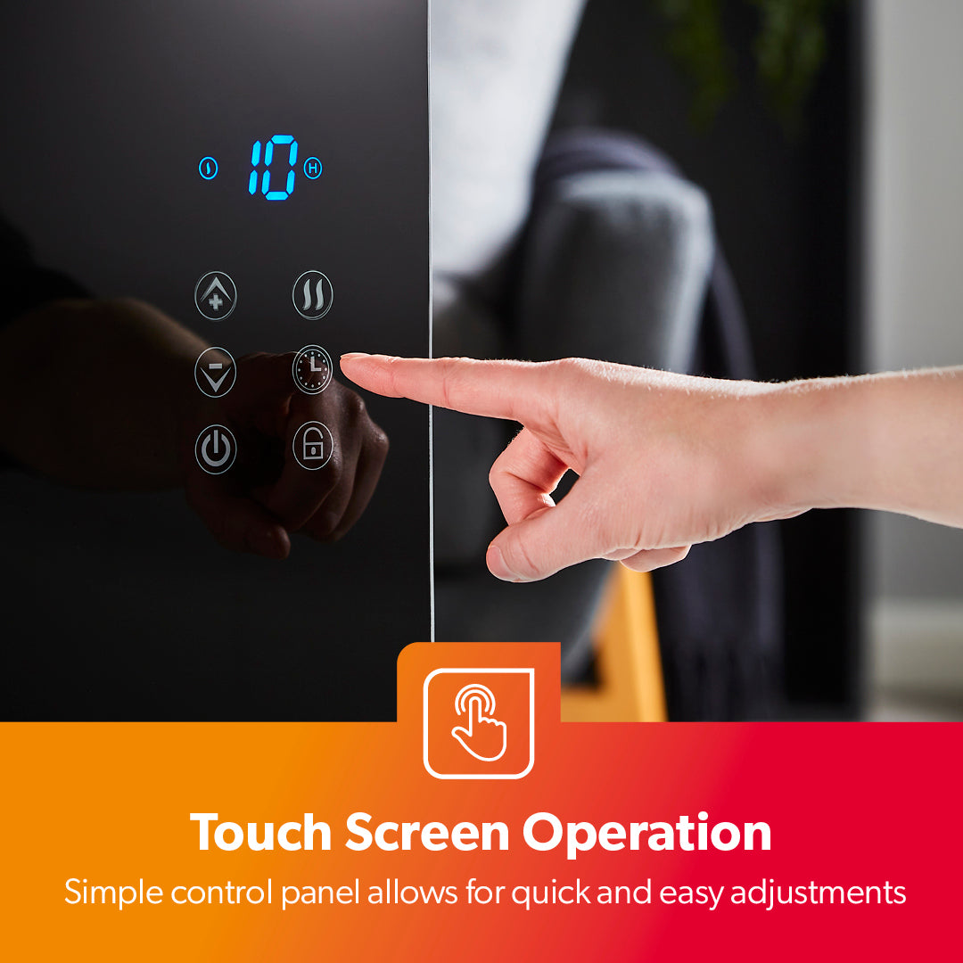 The image shows off a person using the touchscreen controls on the panel heater to adjust the temperature and the timer of the heater.