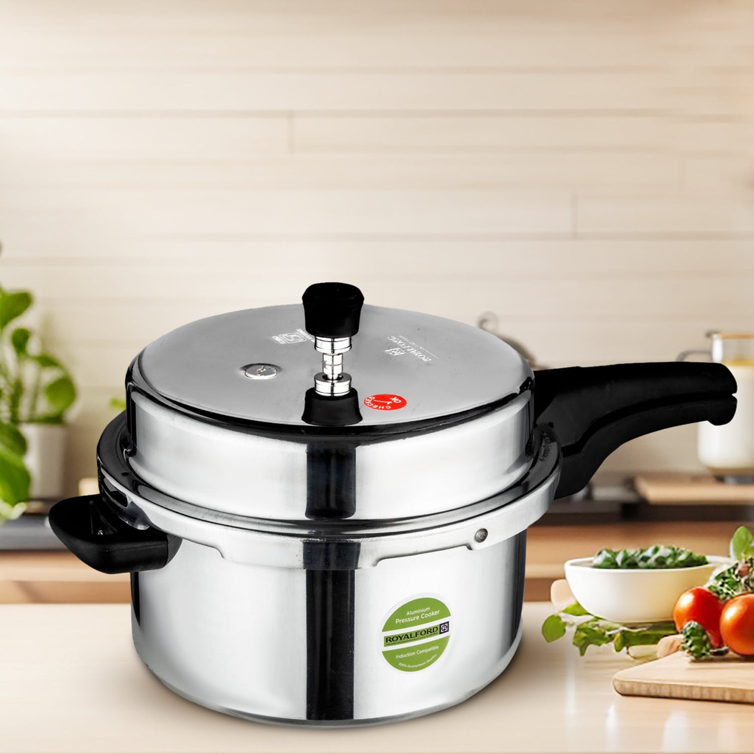 A lifestyle image of the 7L pressure cooker on top of a kitchen countertop with different ingredients around it.