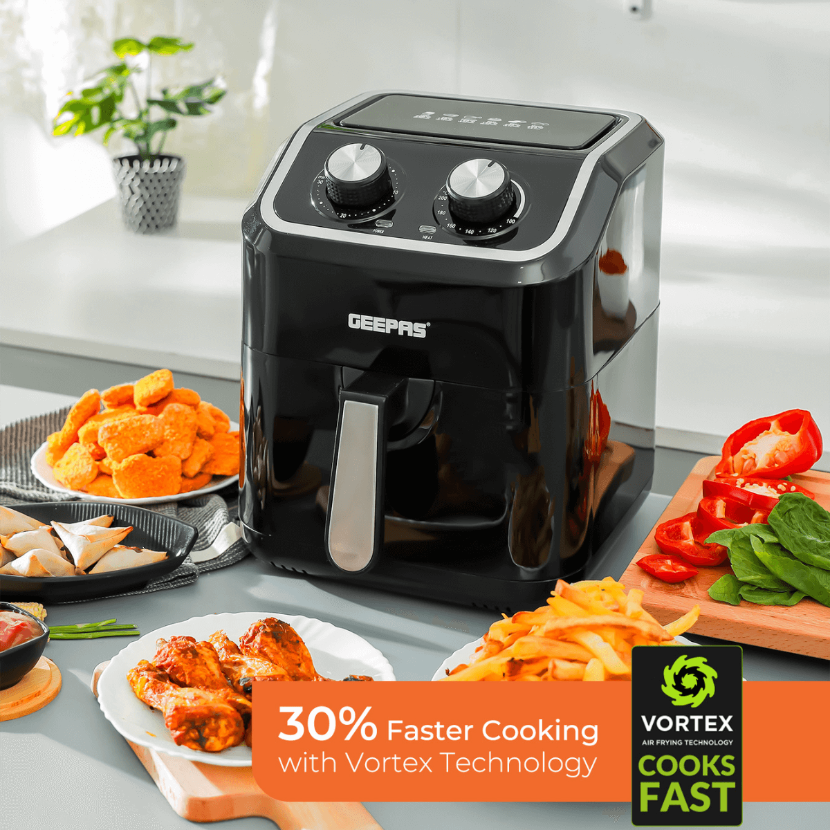 The 5L air fryer on a kitchen countertop, with different dishes of food around it. The banner shows the air fryer vortex cooking technology.