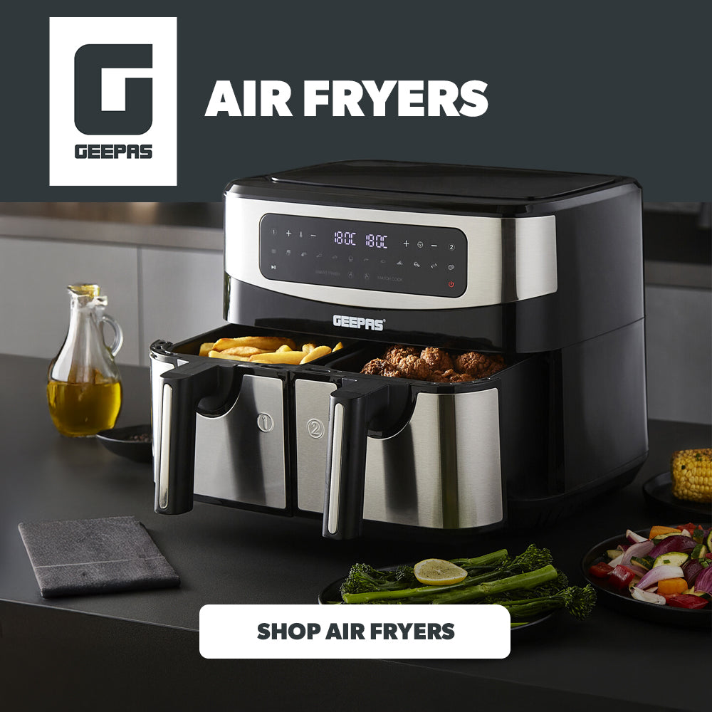 A dual basket air fryer on top of a kitchen countertop with a few air fried dishes beside it with the air fryer collection link attached.