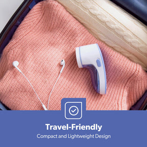 The image shows off the small and compact size of the lint remover fitting it into a travel bag with some clothes on there.