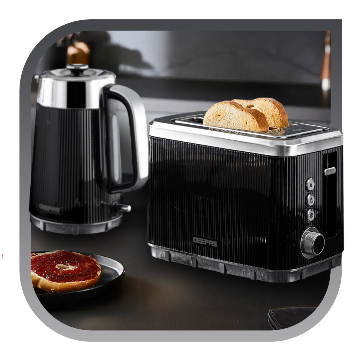 Arcus black and silver kettle and toaster set on top of a kitchen countertop.