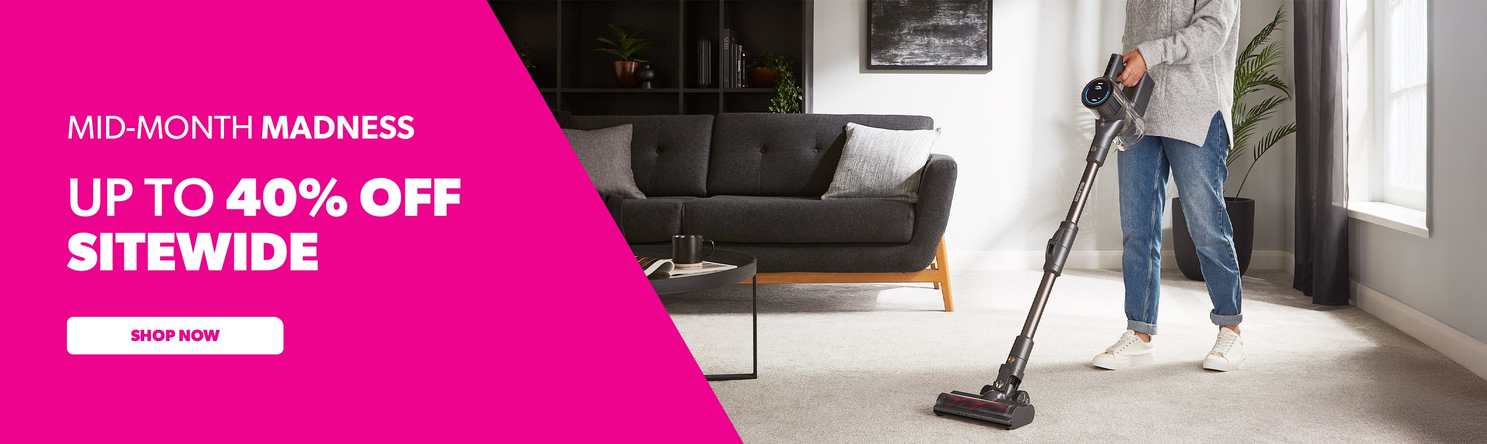 The image shows off the cordless digital vacuum cleaner being used in the living room. Besides it you have the mid month madness appliance sale text.