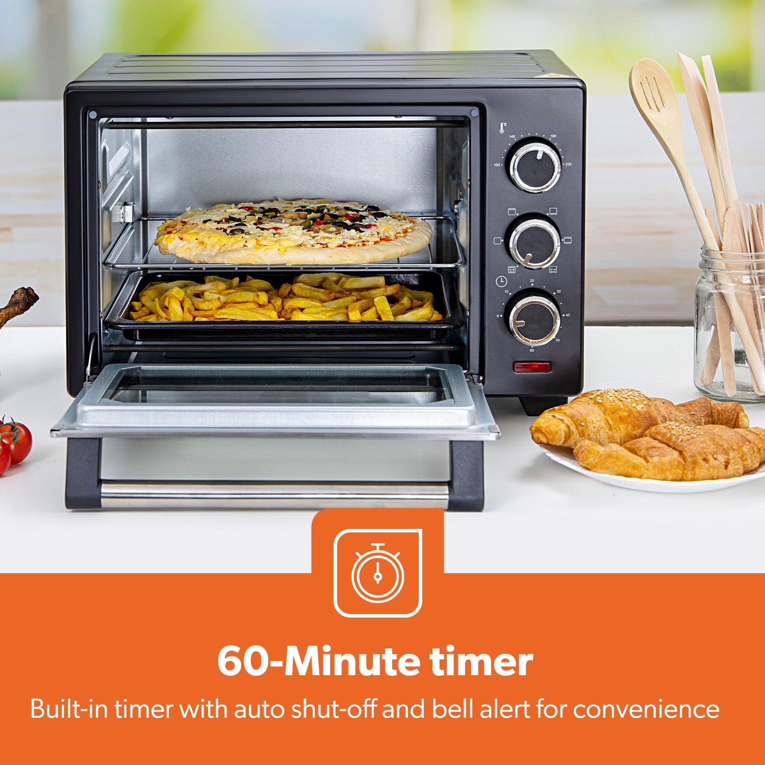 The image shows off the 60 minute timer function on the electric mini oven.