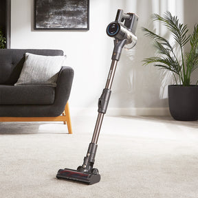 Lifestyle image of the vacuum cleaner in an upright position in the living room.