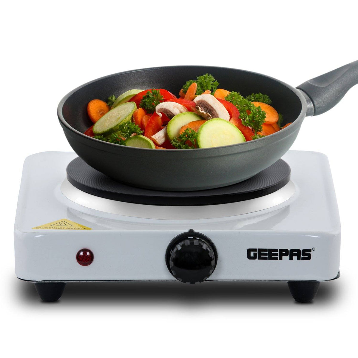 The image shows off the single electric portable hot plate with a frying pan and vegetables inside of it